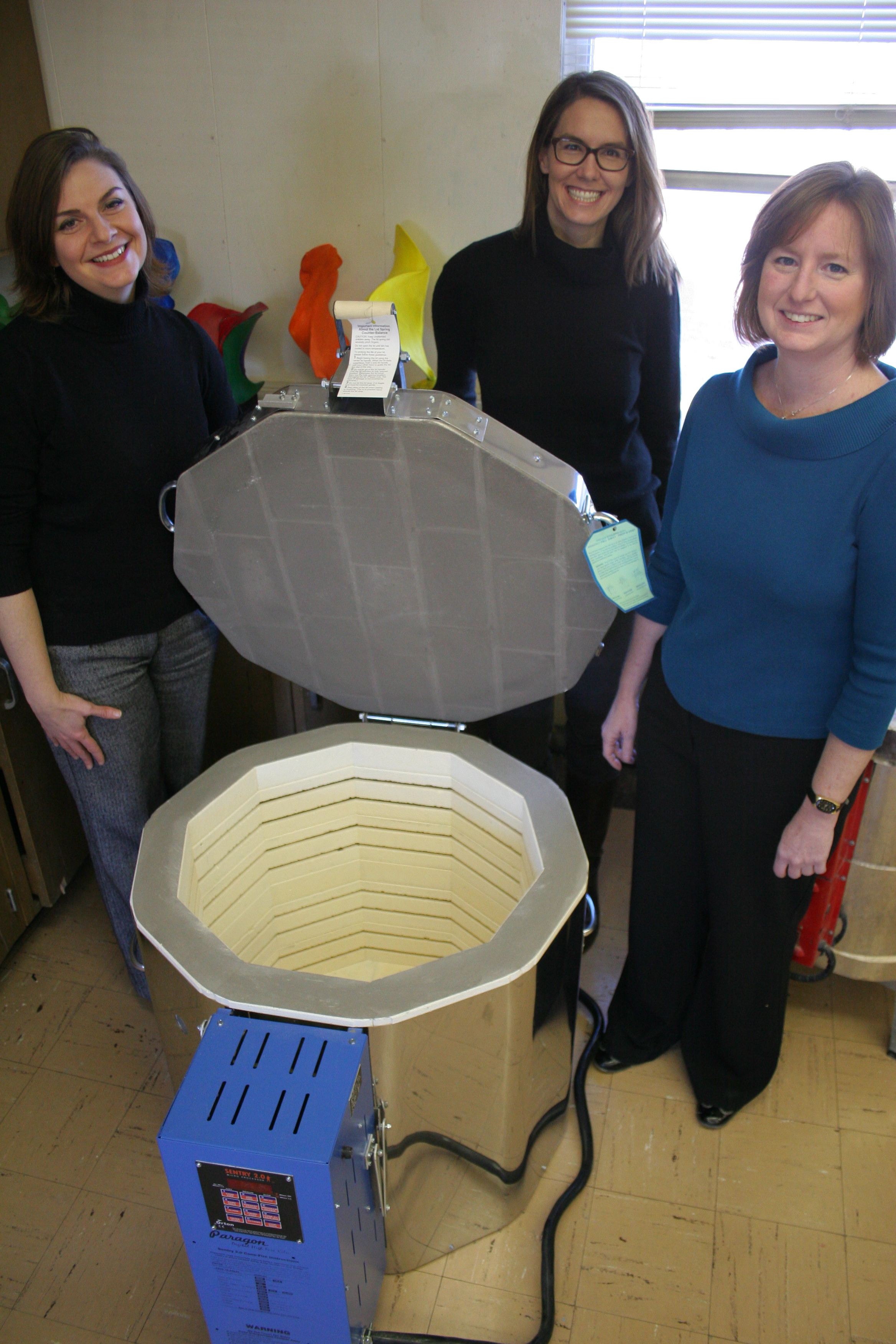 Ballroom Marfa Director of Development JD DiFabbio and Executive Director Fairfax Dorn join Marfa ISD art teacher, Kathy Urban, in welcoming the school's new kiln. Photo by Fred Covarrubias.